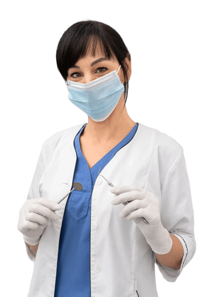 Smiling female dental professional wearing mask and holding dental tools at Smile Center Turkey dental clinic.
